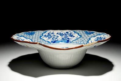 A Dutch Delft blue and white chinoiserie shaving bowl, 18th C.